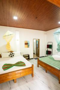 Postel nebo postele na pokoji v ubytování Horizon Resort & Hostel Sigiriya