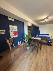 a room with a bed and a desk with a table at Confini Retreat in Minturno