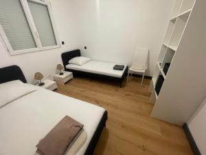 a small room with two beds and a couch at Villa de luxe Piscine 5 chambre in Vescovato +3 photos