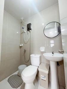 a small bathroom with a toilet and a sink at Maison de Jacinta - 2BR HOUSE NEAR AGUINALDO HIGHWAY in Dasmariñas