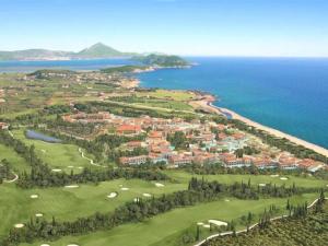 an aerial view of a golf course next to the ocean at Villa Gaia Navarino in Korifásion