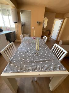 a dining table with candles on it in a kitchen at City centro 5th Floor sin ascensor No Lift Long time good price in Valencia