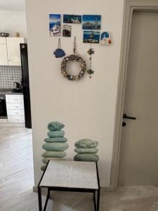a stack of towels on a table in a room at Pebble Sea House in Orfánion +20 photos