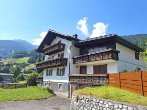 a large house with balconies on the side of it at Alpenfeder Hüsli in Tschagguns