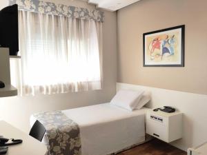 Posteľ alebo postele v izbe v ubytovaní Cosmos Hotel