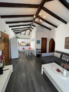 a living room with a couch and a table at Casa Brisa Abades in Abades