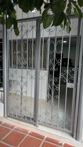 an open door with a wrought iron gate at Mami yola 2 in Valledupar