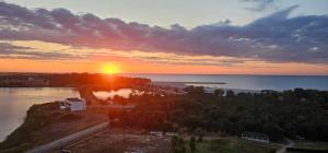 an aerial view of the sun setting over the water at Blue Sea OLIMP by Any - Etaj PREMIUM cu vedere la Mare in Olimp