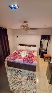 A bed or beds in a room at Summer Land Hotel