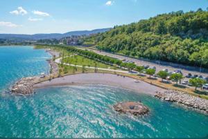an aerial view of a body of water with a bridge at ViMaJU in Koper