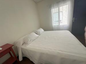 Ένα ή περισσότερα κρεβάτια σε δωμάτιο στο Apartamento en el centro de Talavera