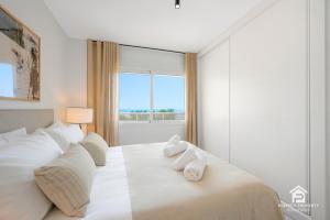 Postel nebo postele na pokoji v ubytování Wyndham - Bright and Modern 2BR with Sea Views in + 31 fotografií