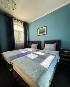 Postel nebo postele na pokoji v ubytování Guesthouse Prenociste Faraon