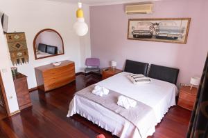 En eller flere senge i et værelse på Casa Looks