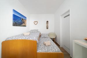 Ένα ή περισσότερα κρεβάτια σε δωμάτιο στο Casa dos Avós