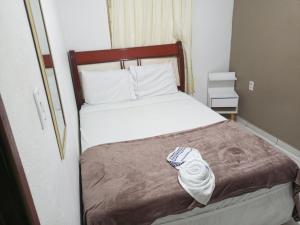 Postel nebo postele na pokoji v ubytování Pousada e Hostel Maria Bonita