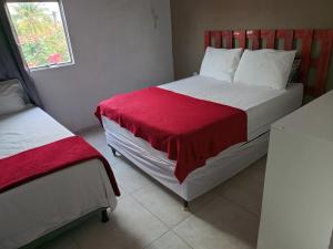 Postel nebo postele na pokoji v ubytování Pousada e Hostel Maria Bonita