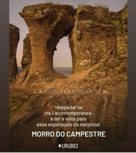 a poster of a rock formation in the desert at Cabana QUARTZO- Vista para PONTO TURISTIC0 Pedra Morro do Campestre- ACESSO até a cabana asfaltado in Urubici