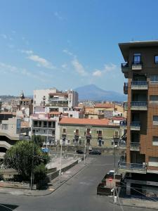 a view of a city with a street and buildings at Casa Giardina in Catania