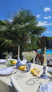 a table with blue and white vases on it at Apartments Franka in Samobor