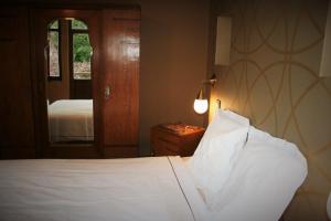 Cama ou camas em um quarto em Lumen7