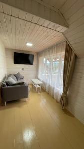 TV a/nebo společenská místnost v ubytování Mini Cottage