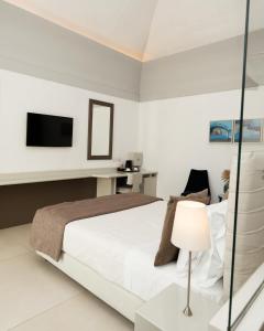 Postel nebo postele na pokoji v ubytování Villa Gervasio Rooms