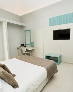 TV a/nebo společenská místnost v ubytování Villa Gervasio Rooms