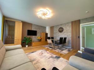 a living room with a couch and a table at Kandelblick in Waldkirch