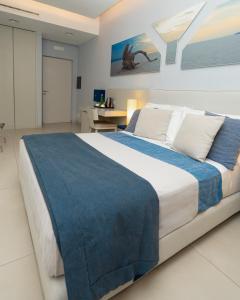 Postel nebo postele na pokoji v ubytování Villa Gervasio Rooms