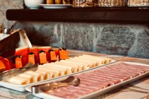 a table with two trays of food on a table at Calmaria Suítes Búzios in Búzios