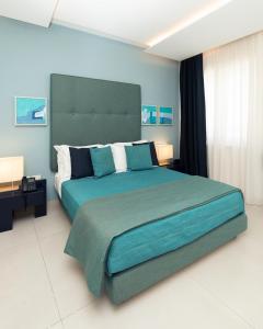 Postel nebo postele na pokoji v ubytování Villa Gervasio Rooms