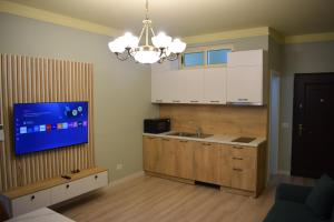 Kuchyň nebo kuchyňský kout v ubytování Majo Apartments