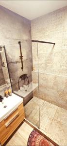 a bathroom with a shower and a sink at Apartment, private garage, balcony, smart check in in Banská Bystrica +9 photos