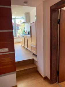 a kitchen with a hallway leading to a kitchenasteryasteryasteryasteryasteryasteryastery at Ferienwohnung Hempfling in Rostock
