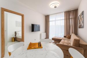 Un televizor și/sau centru de divertisment la Apartament Przy Fali Sianożęty
