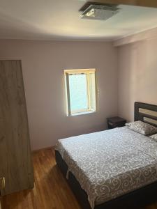 Una cama o camas en una habitación de Iva apartment