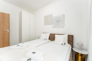 Un pat sau paturi într-o cameră la Apartament Przy Fali Sianożęty