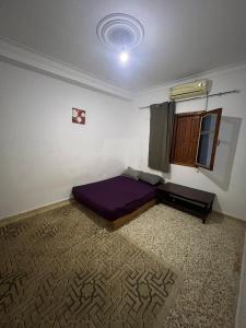 Postel nebo postele na pokoji v ubytování El Beldj