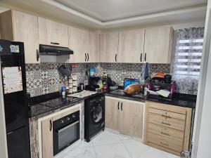 Køkken eller tekøkken på Résidence Al Yakout - Grand Appartement Avec Piscine