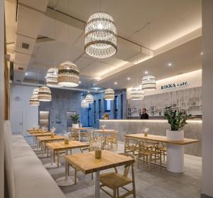 a restaurant with wooden tables and chairs and a counter at RIKKA KHUST thermal resort in Khust