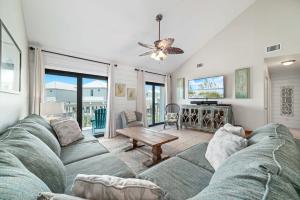 a living room with a couch and a table at Cotton Bayou Unit 4F in Orange Beach