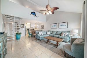 a living room with a couch and a table at Cotton Bayou Unit 4F in Orange Beach +38 photos