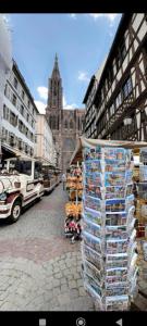 a display of items on a street in a city at logement 3 pièces à 10 minutes du célèbre marché de Noël de Strasbourg in Schiltigheim