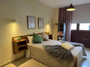 a bedroom with a bed with green pillows at Casa Maricarmen villa in Tacoronte