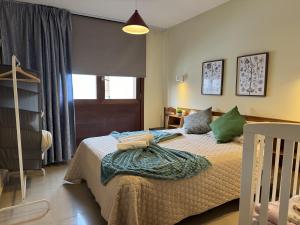 a bedroom with a bed and a window at Casa Maricarmen villa in Tacoronte