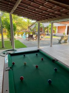 a green pool table under a pavilion with a pool table at Recanto do Lima in Camocim