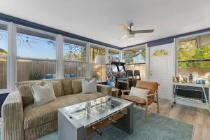 a living room with a couch and a table at New listing~10 min to beach~Back yard fun~Pool in Cross Bayou