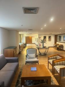 a living room with a couch and chairs and a table at Flat Ibirapuera V Mariana Borges Lagoa com garagem 512 in Sao Paulo