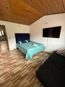 Postel nebo postele na pokoji v ubytování El Tikki Haus